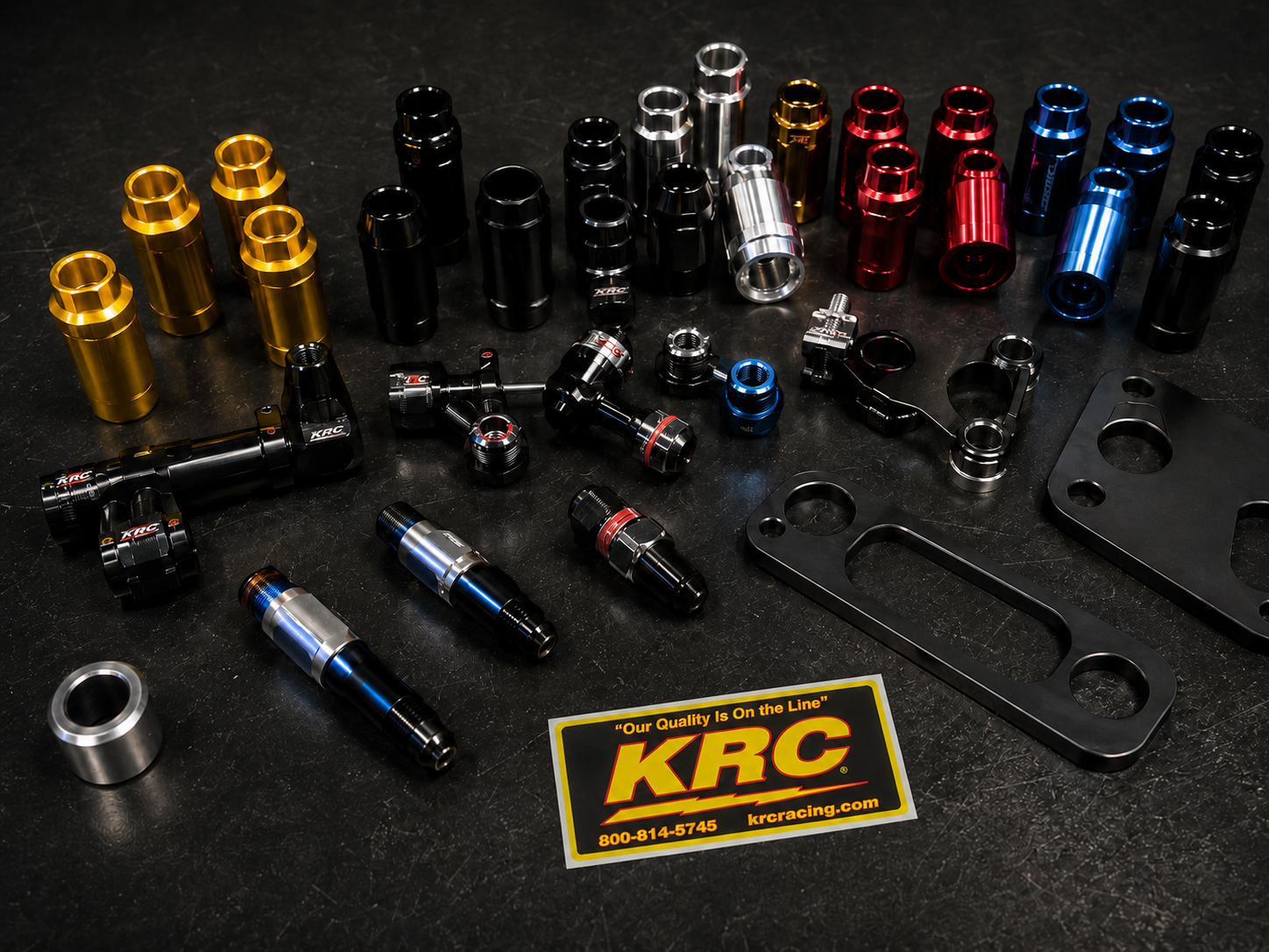 Collection of automotive parts on a black surface with KRC branding.